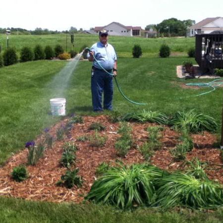 Man watering a garden